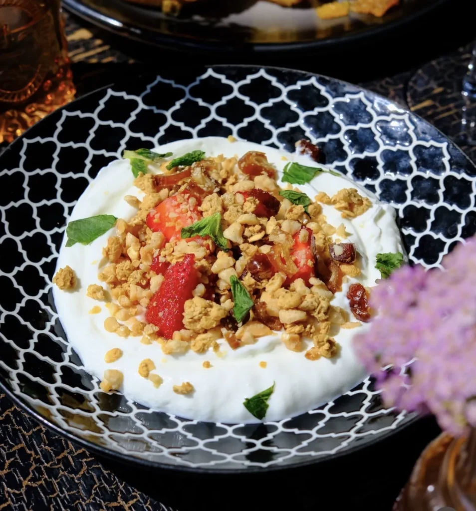 Yogurt parfait with strawberries and moconna granola at Wolf & Co.